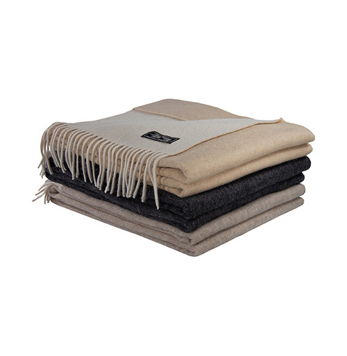 Luxury Wool and Cashmere blend throws. Soft and cozy, the accessory thing to cuddle with place at the foot of the bed, chair or couch. Available in Camel, Flax and Grey.
